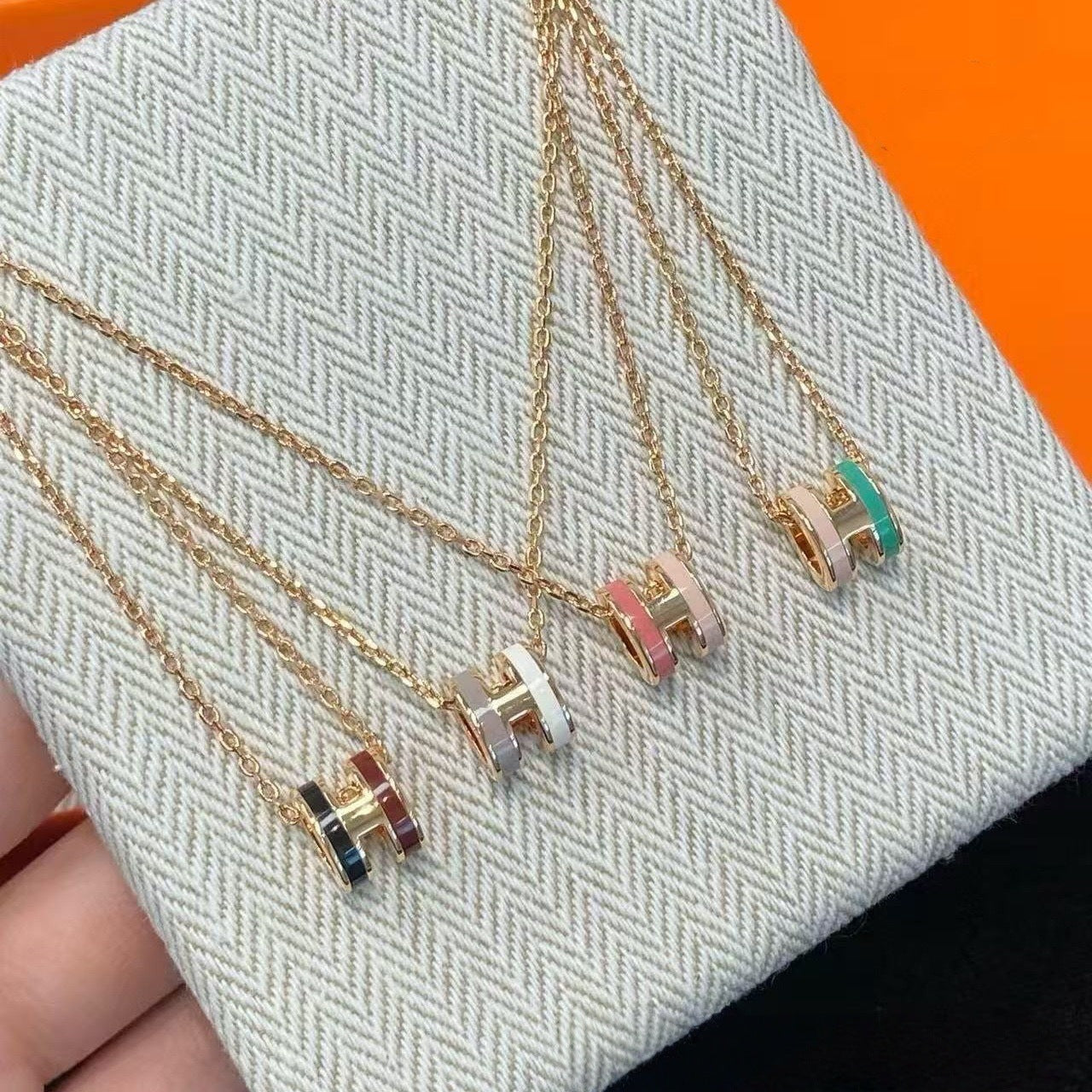 Two-tone enamel H necklace