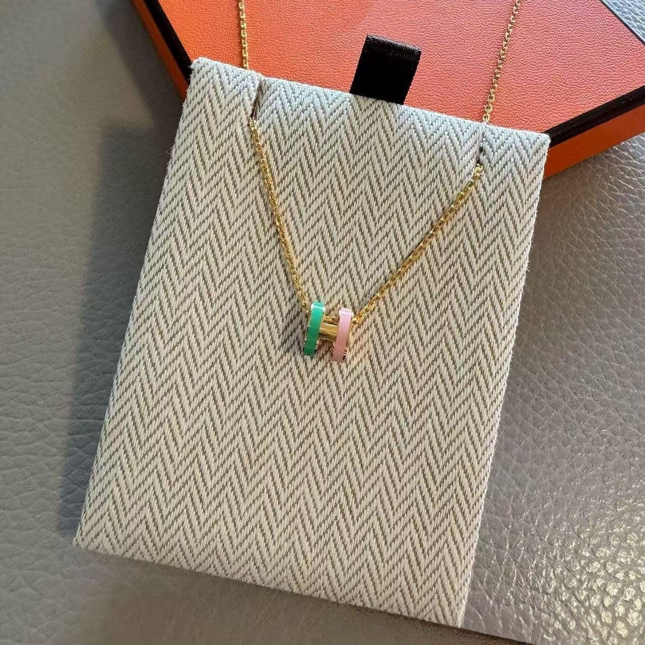 Two-tone enamel H necklace